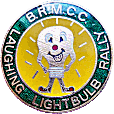 Laughing Lightbulb motorcycle rally badge from Jean-Francois Helias