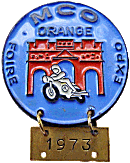 Orange motorcycle rally badge from Jean-Francois Helias