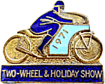 Two-Wheel & Holiday motorcycle show badge from Jean-Francois Helias